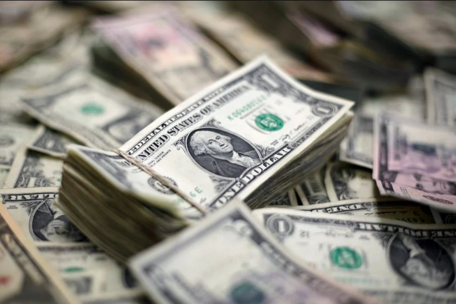 Canadian dollar weakens to 14-month low as U.S. dollar gains; inflation cushions losses
