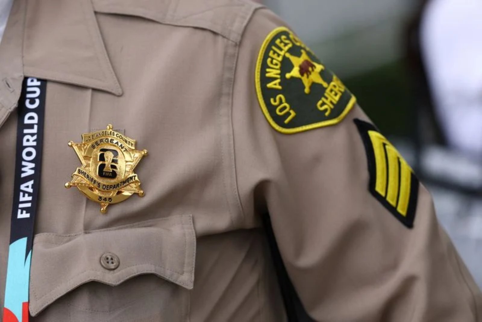 Gold World Cup Badges Signal Pride for Police and Firefighters Securing Matches in Inglewood