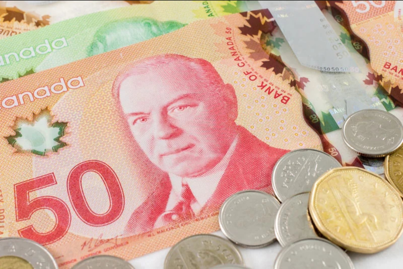 Canadian dollar slips as oil remains above $100 and U.S. inflation data looms