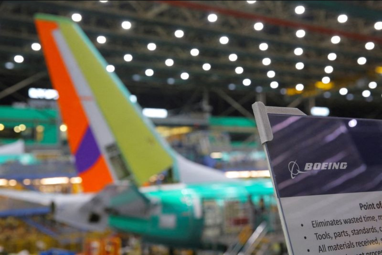 Boeing narrows quarterly loss as production and defense work support recovery